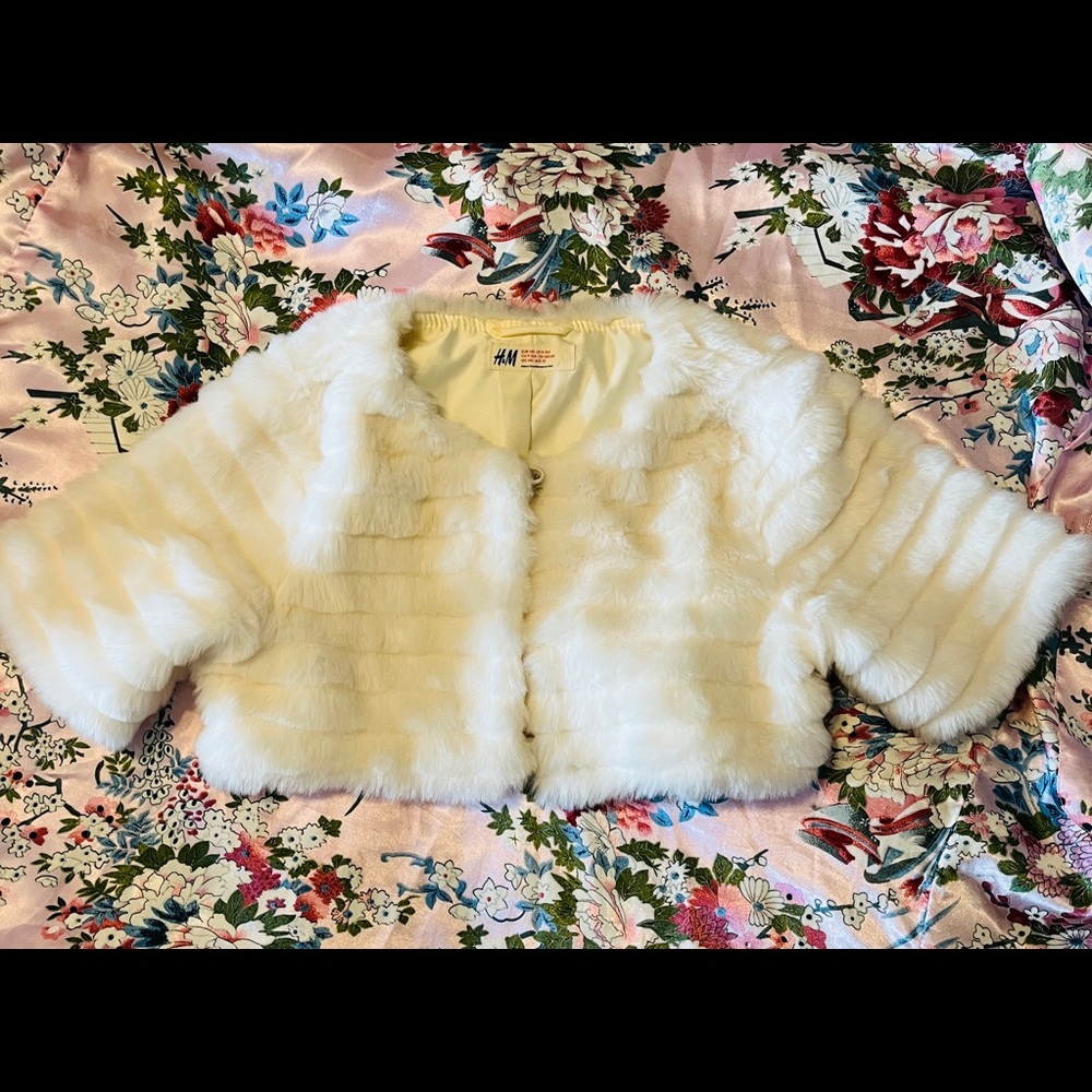 Cute little faux fur bolero for over fancy dresses. Great condition.